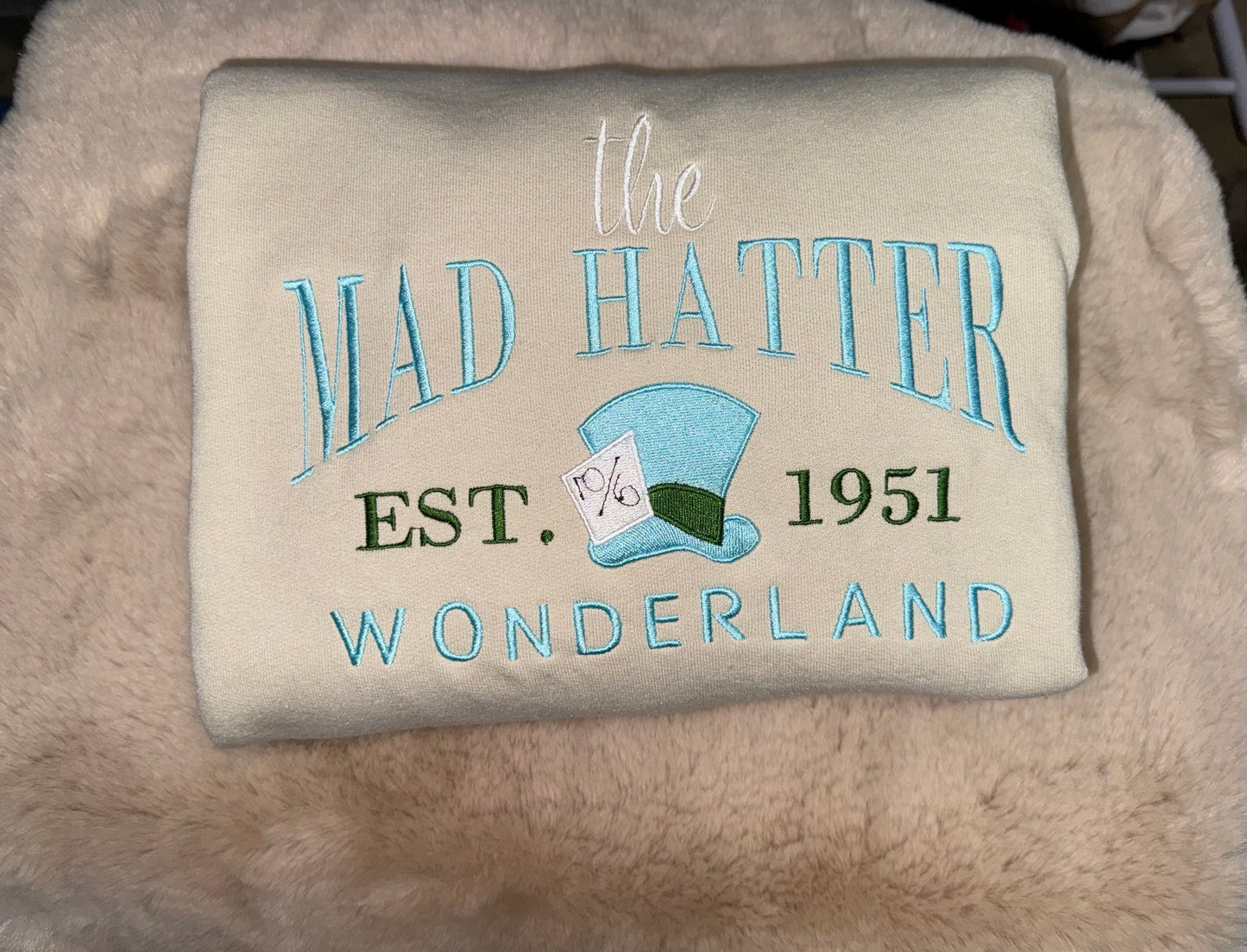 The mad hatter embroidery crewneck