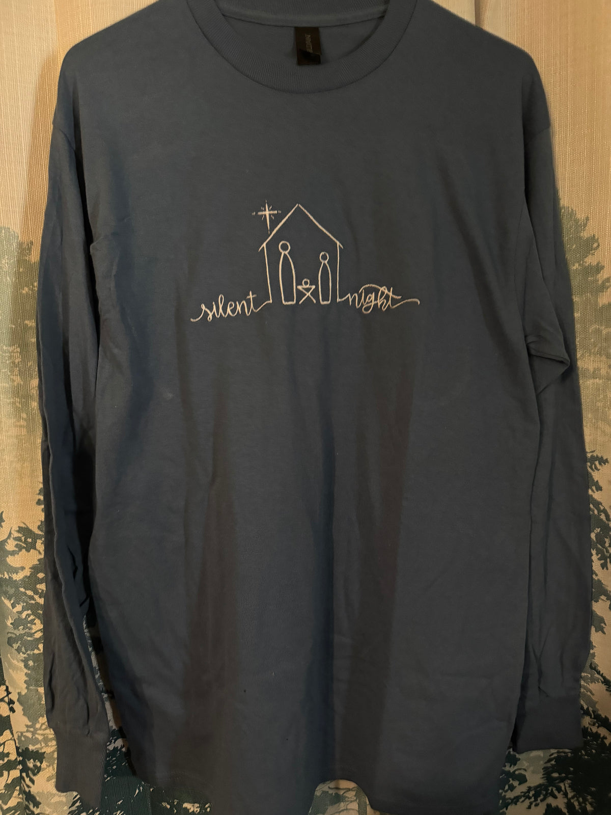 Medium Gildan long sleeve tee Silent night (manufacturer flaw shown in second photo, bunching in the sleeve)