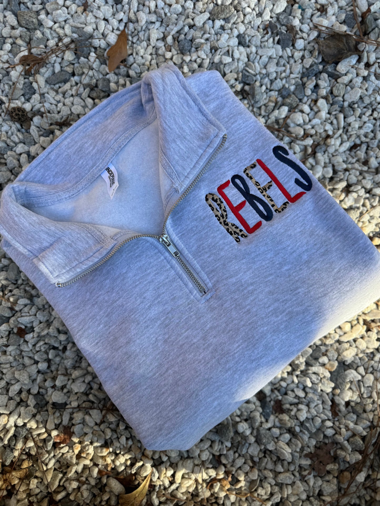 Leopard rebels pocket 1/4 zips and crews