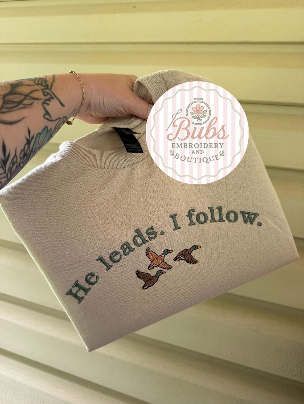 He leads. I follow. Embroidery