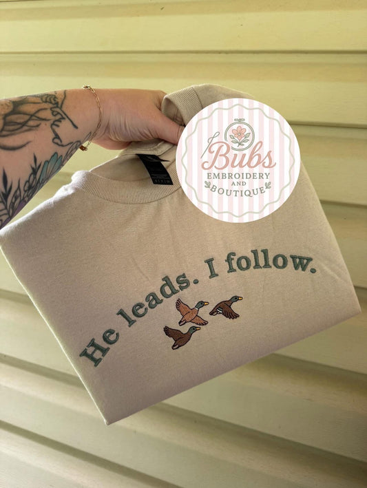 He leads. I follow. Embroidery