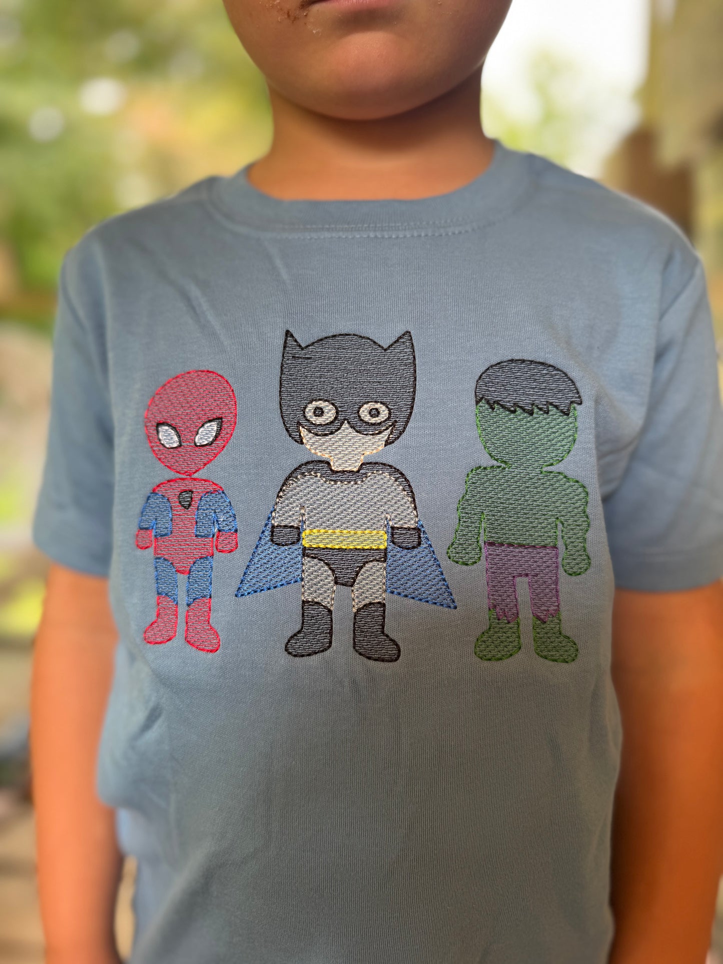 Toddler superhero’s sketch embroidery
